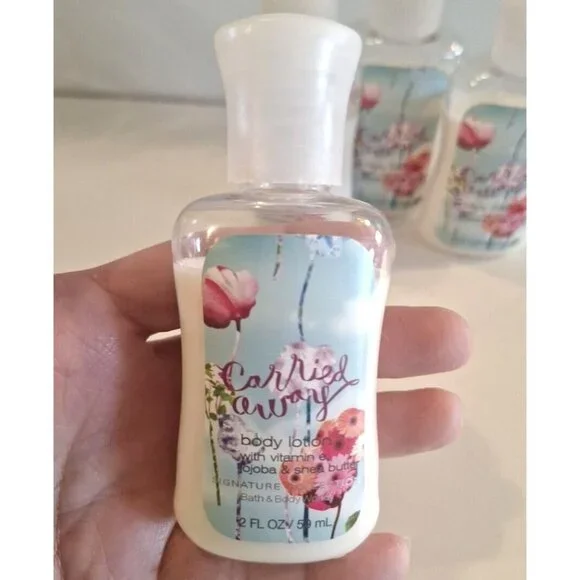 Carried Away Body Lotion 2 Fl Oz Travel Size Vitamin E Jojoba Shea Butter - Picture 2 of 5